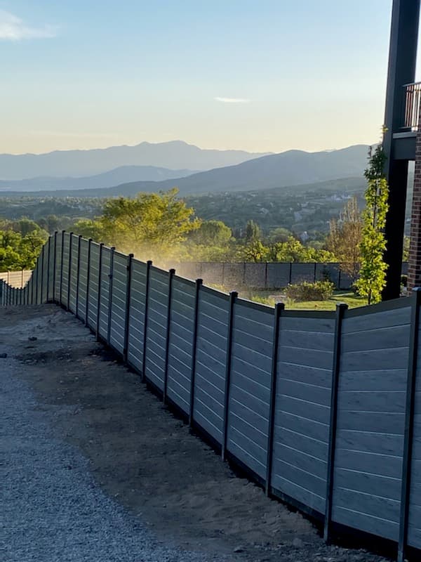 Hillside fence with valley view by SG Landscaping